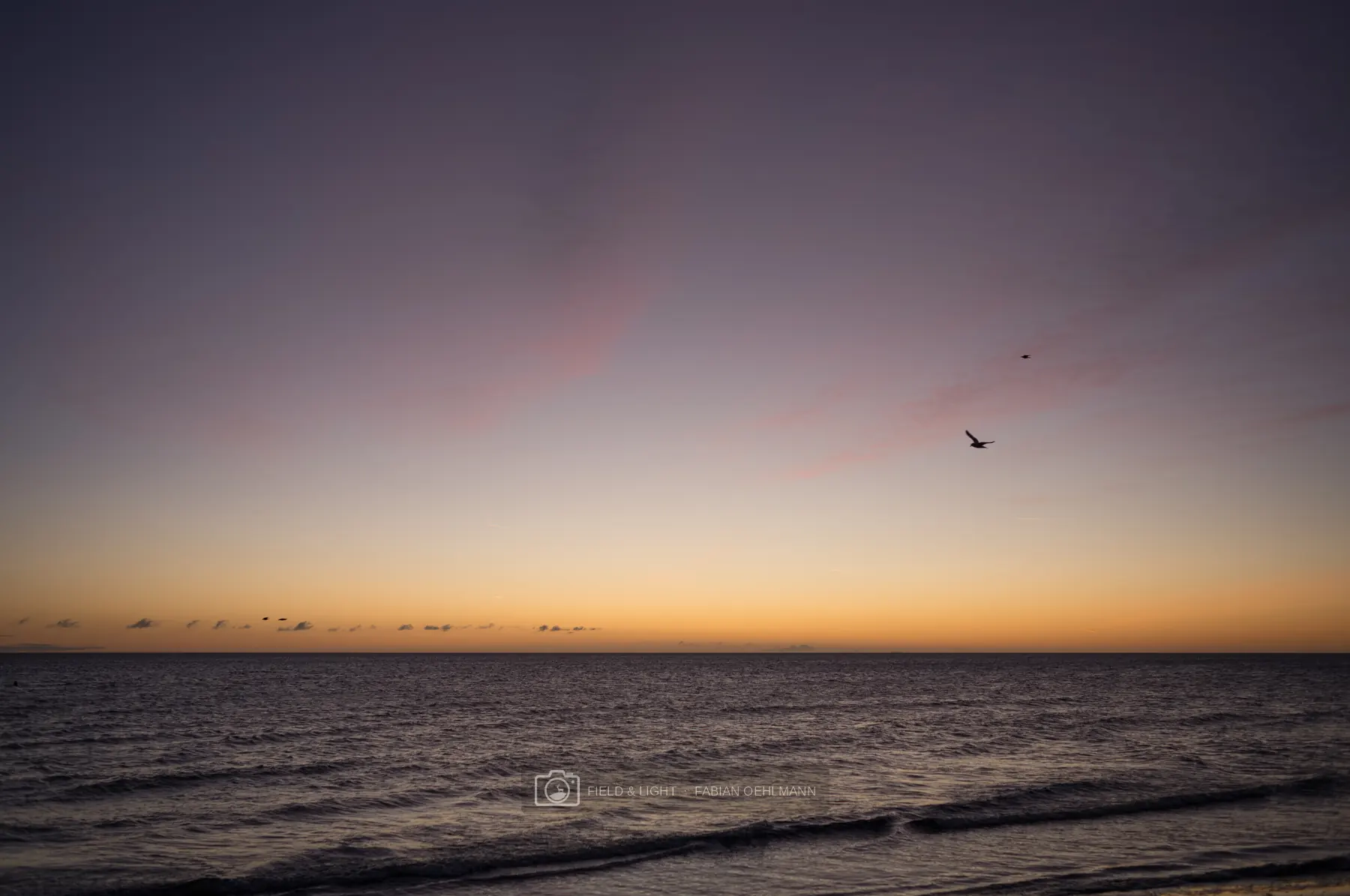 Minimal sunset over a calm sea