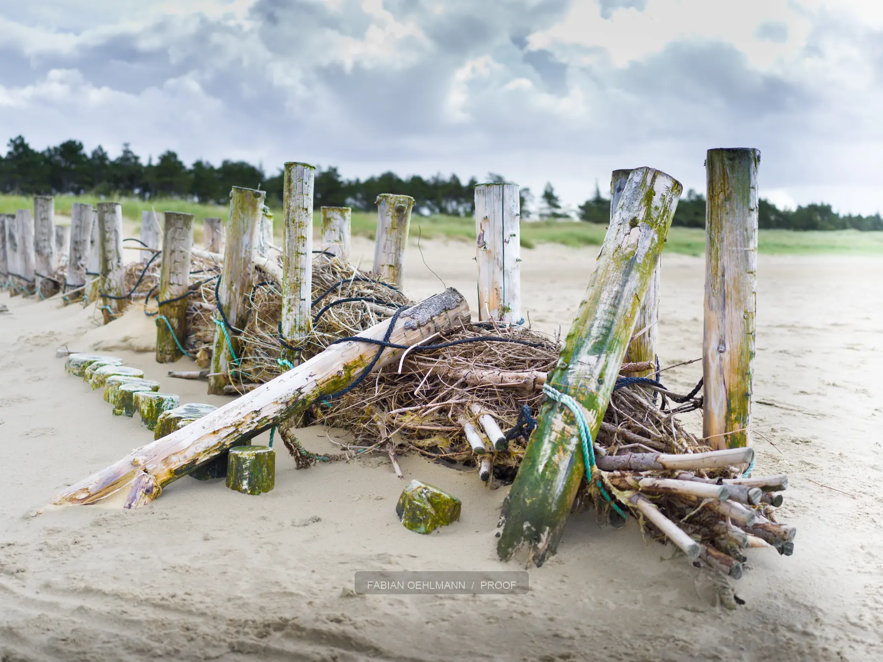 Weathered timber structure on a white beach